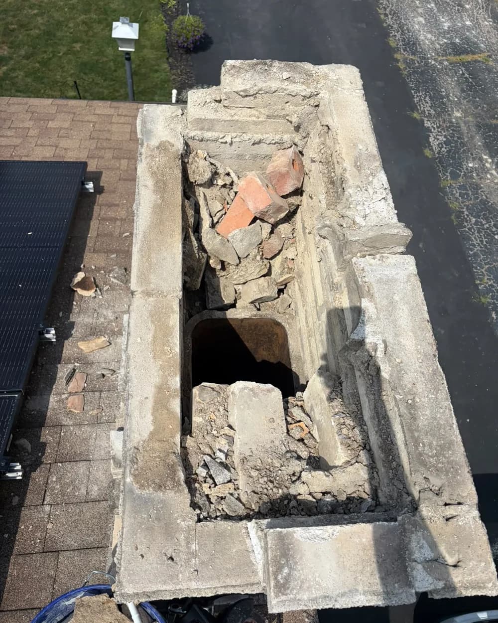 Overhead view into the opened chimney top during crown work